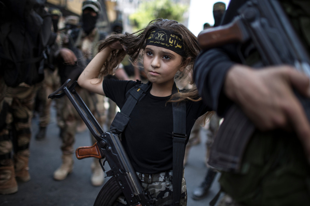 Palestinian girl with Kalashnikov rifle