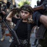 Palestinian girl with Kalashnikov rifle