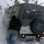 car in snowy road in Spiti