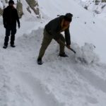 clearing road in winter spiti road trip